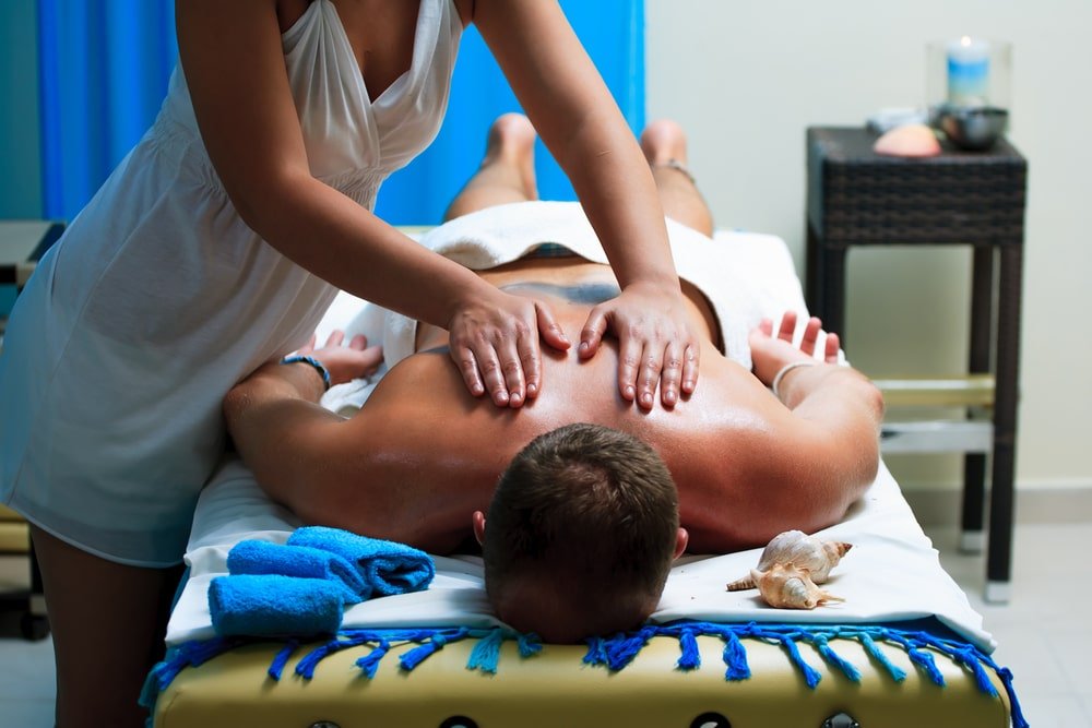 Man receiving erotic massage in studio