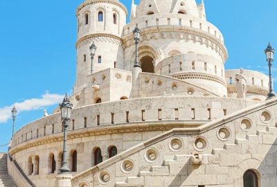 Budapest city guide.Fisherman's Bastion.02 Towers of Fisherman's Bastion against the blue sky in Budapest