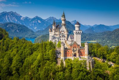 Munich city guide.Neuschwanstein Castle.02 Neuschwanstein Castle situated in mountains near Munich