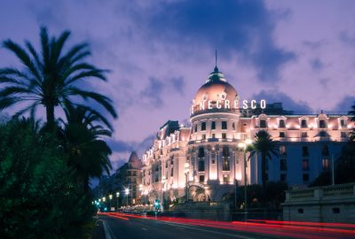 Nice city guide.Hotel Negresco.01 Hotel Negresco at the Promenade des Anglais in Nice at evening