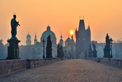 Prague city guide.Charles Bridge.01 Charles Bridge and its Baroque statues in Prague at sunset