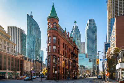 Toronto city guide.Gooderham or Flatiron Building.01 Gooderham or Flatiron Building in Toronto with skyscrapers at the background