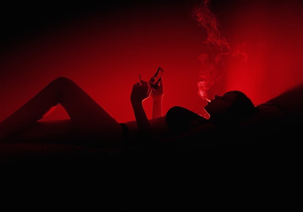 Girl smoking in red light district