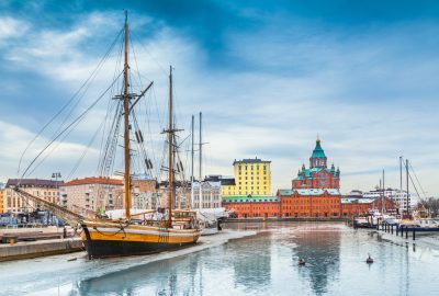 Helsinki city guide.Katajanokka harbour side.01 An old ship in Katajanokka harbour, Helsinki and the Russian Orthodox Cathedral in the distance