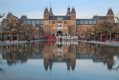 Amsterdam city guide.I amsterdam sign and the Rijksmuseum.01 The I amsterdam sign with the Rijksmuseum in Amsterdam at the backdrop