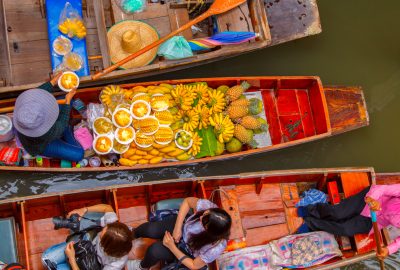 Bangkok city guide.Damnoen Saduak floating market.02 Locals in Bangkok selling fruits on boats at the floating market of Damnoen Saduak
