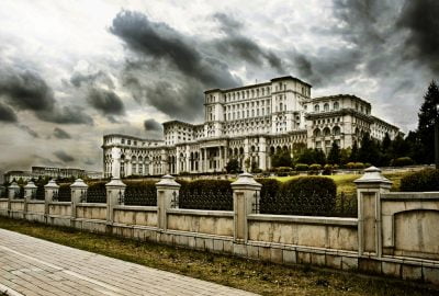 The huge Palace of the Parliament (Palatul Parlamentului) to the backdrop of a dramatic grey sky