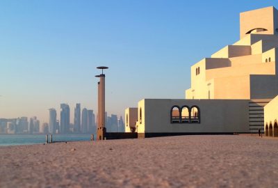 Doha city guide.Museum of Islamic Art.01 Museum of Islamic Art at Doha Corniche, a waterfront promenade with skyline of Doha