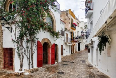 Ibiza city guide.Old Town Eivissa.01 Cobbled street with charming traditional Spanish houses in Ibiza's Old Town (Vila d'Eivissa)