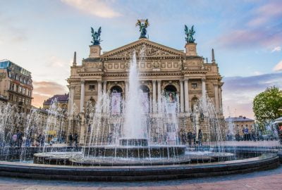 Lviv city guide.Lviv Opera.01 Lviv Opera in early evening with working fountains in forefront