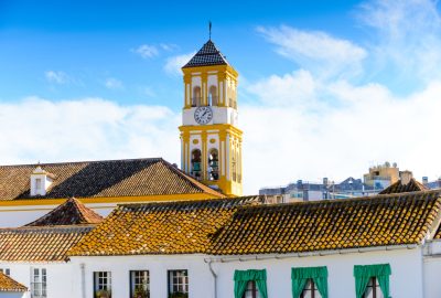 Yellow and white tower of the Iglesia Mayor de Santa María de la Encarnación in Marbella