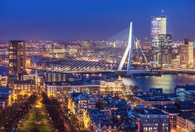 Rotterdam city guide.Erasmus Bridge.01 Erasmus Bridge over the Maas river and Rotterdam city skyline by night