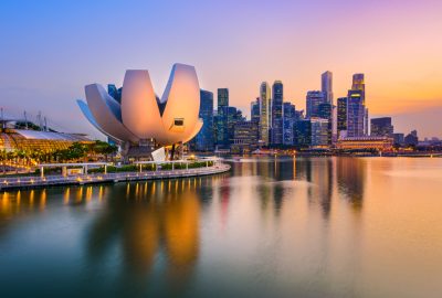 Singapore city guide.Marina Bay.01 Marina Bay with ArtScience Museum and skyscrapers in Singapore by evening