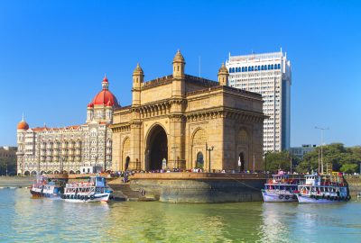 Mumbai city guide.Gateway of India.01 View of Gateway of India from the water with at the backdrop the Taj Mahal Palace and Tower Hotel