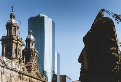 Santiago city guide.Plaza de Armas and Monumento al Pueblo Indigena.02 Plaza de Armas, Monumento al Pueblo Indigena, skyscraper and Santiago Metropolitan Cathedral