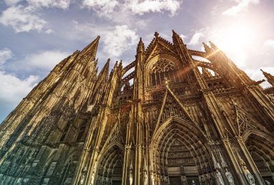 Cologne city guide.Cologne Cathedral.01 Cologne Cathedral illuminated by sun, view from below