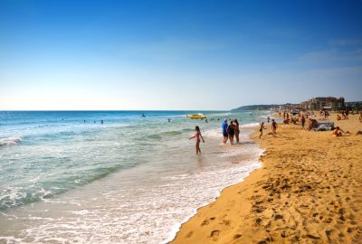 Locals and tourists enjoying the beaches of Golden Sands