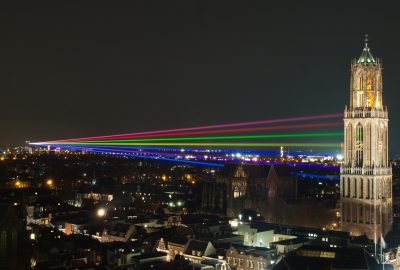 Utrecht city guide.Dom Tower.01 Utrecht Dom Tower illuminated by coloured laser light beams